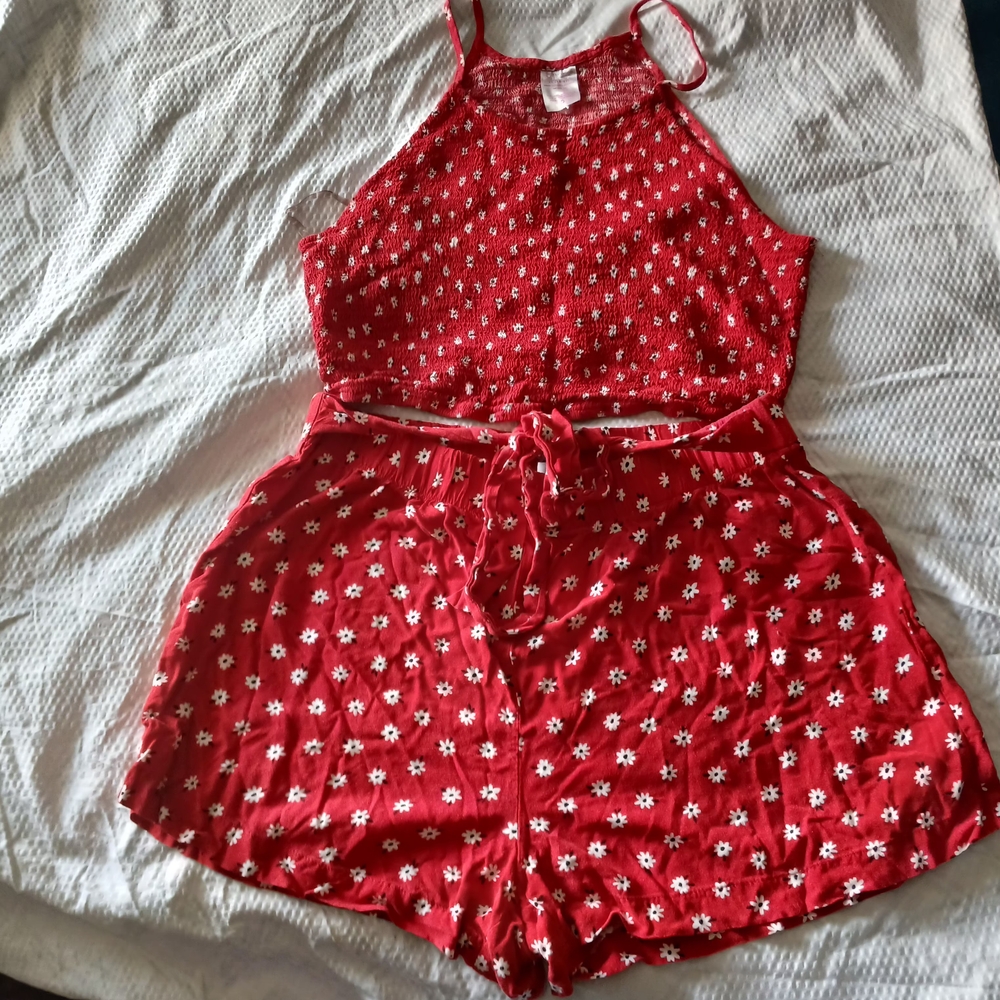 A beautiful women's beach outfit, perfect for summer. beautiful shorts and a flo